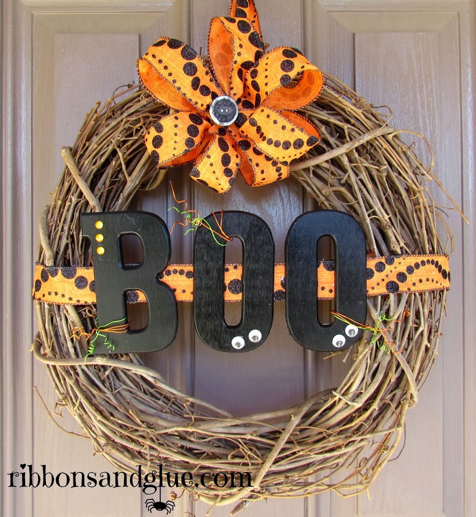 Halloween Boo Wreath made from a grapevine wreath and Halloween ribbon. Painted wood BOO letters make it spooky cute too! 