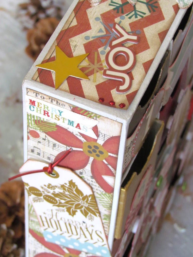 DIY Advent Calendar painted with metallic paints and embellished with scrapbooking paper. 