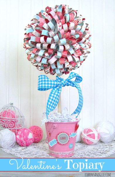 Valentine's Paper Ribbon Topiary. Tutorial on how to make paper ribbons out of scrapbooking paper, hot glue on to foam ball to make beautiful tipiary.