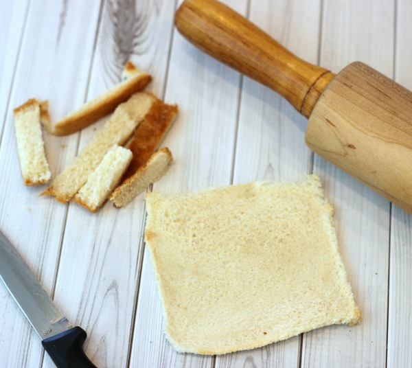 Cut off bread crust and Roll out bread with rolling pin