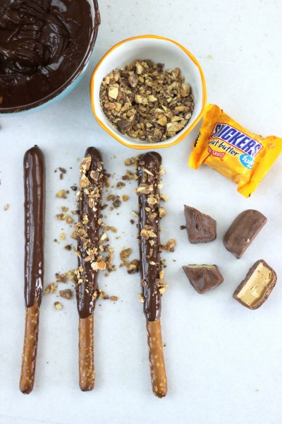 Easy Chocolate Football Pretzel Sticks. Dip pretzel sticks in to melted chocolate and sprinkle with crushed candy bars 