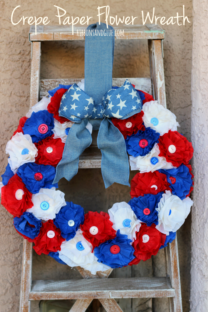 How to make a Patriotic Crepe Paper Flower Wreath. Crepe paper flowers are an inexpensive way ti make a beautiful statement. #makeitfuncrafts