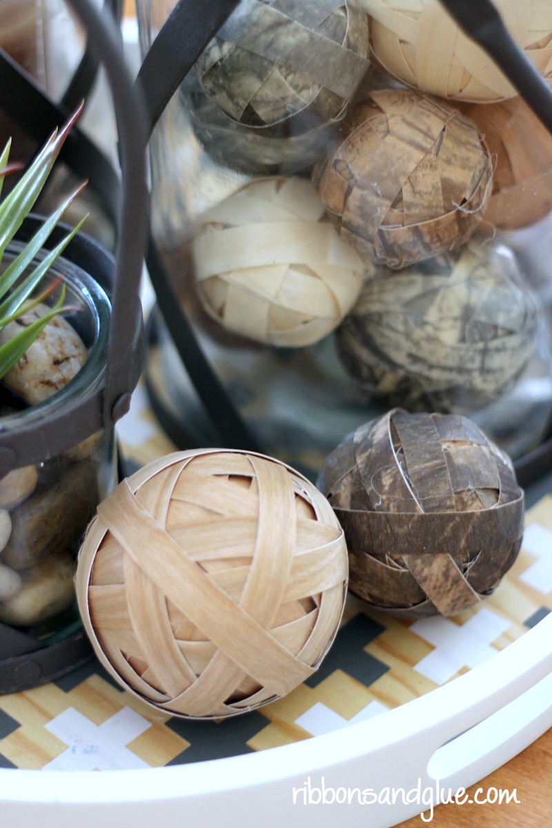 Decorative Wood Ball Centerpiece made with FloraCraft® Make It: Fun® Foam Balls and wood veneer paper. Easy, rustic DIY table centerpiece piece idea. 