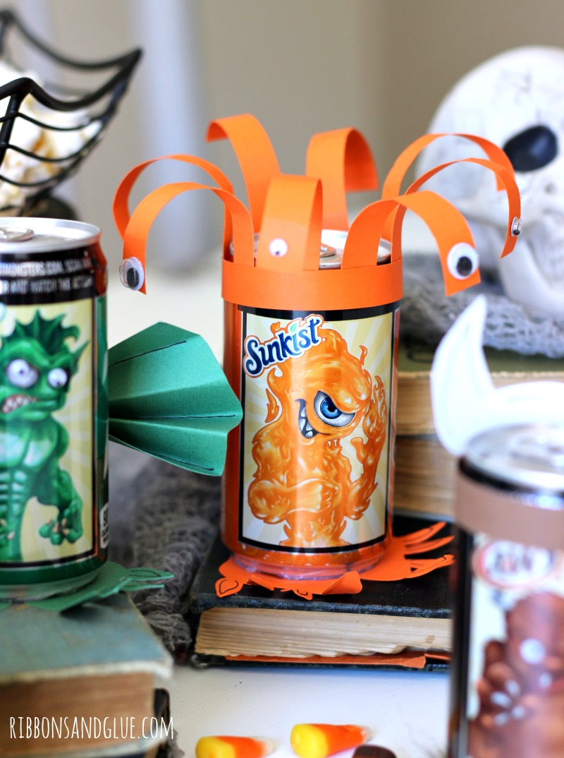 Halloween Mini Monster Soda Cans. Make the monsters come alive on Halloween Soda cans with googly eyes, fur, paper and fur. Fun Halloween Party activity.