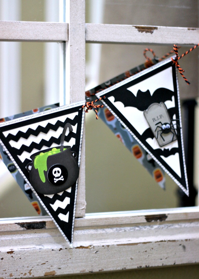Easy Halloween Banner made from a pre-made banner embellished with Halloween stickers and shapes