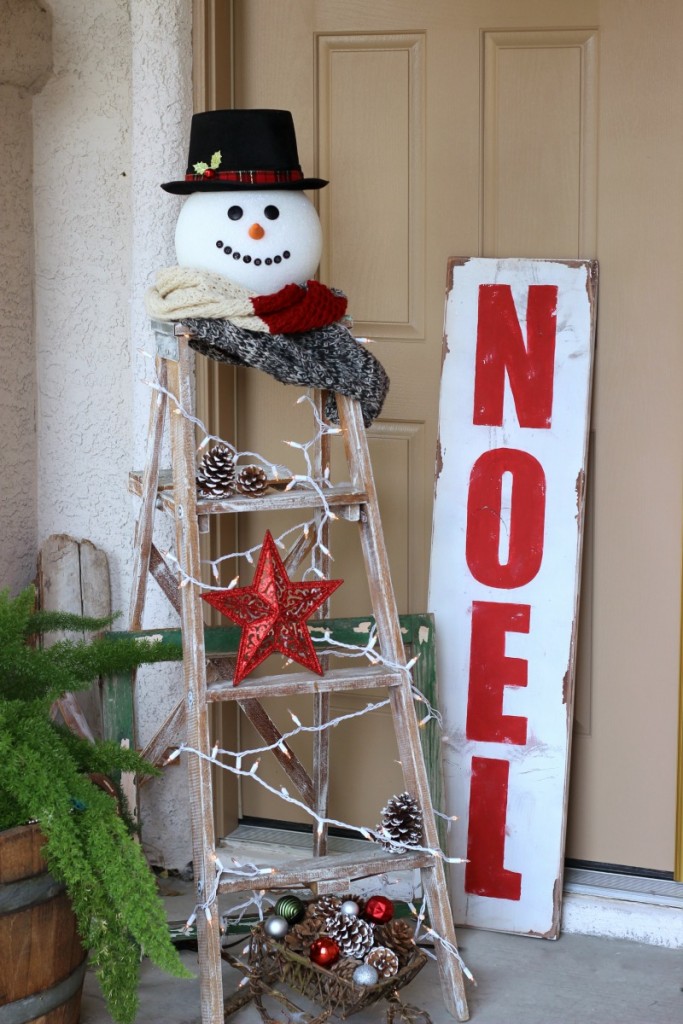 Christmas Snowman Ladder. Large foam ball turned in to a snowman head displayed on top of a vintage ladder 